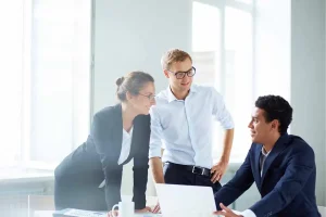Business owners discussing whether an LLC is the right business structure for their company